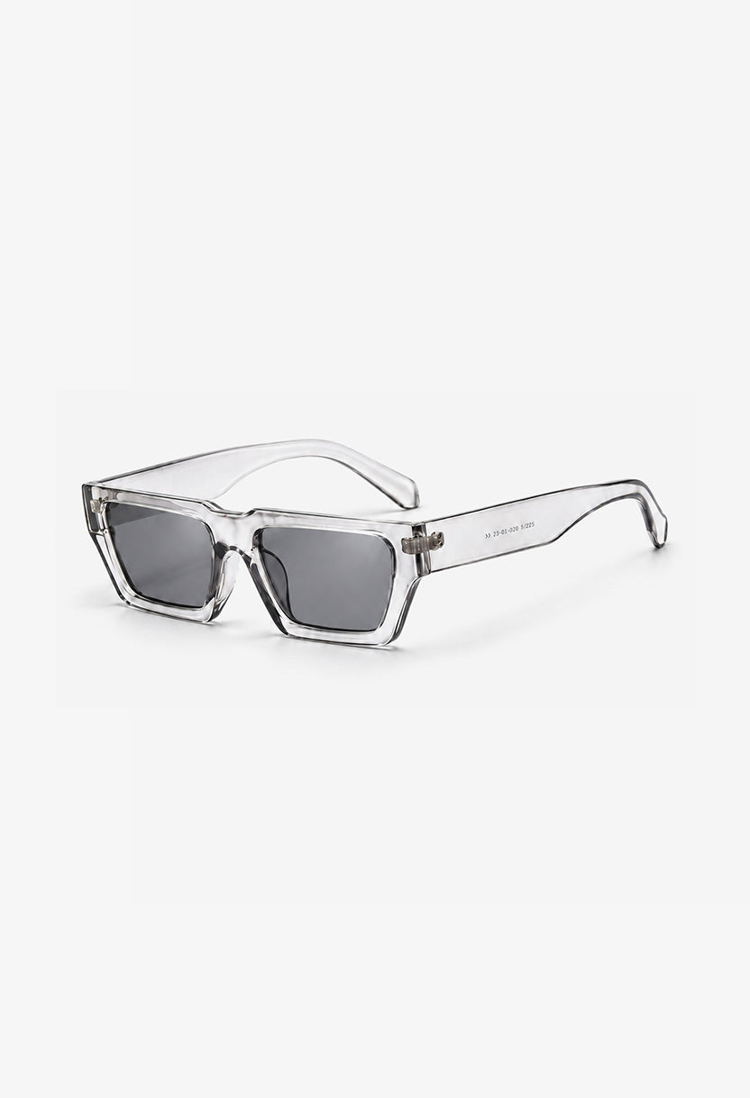 NEW STATEMENT NEXUS sunglasses in transparent, angled view of the clear frame with smoke lenses #color_transparant
