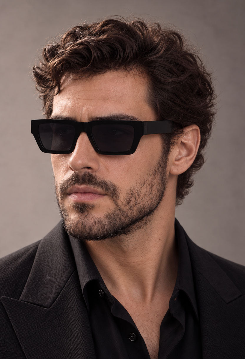 Man wearing NEW STATEMENT NEXUS sunglasses in black, turned to show the flat temple arm #color_black