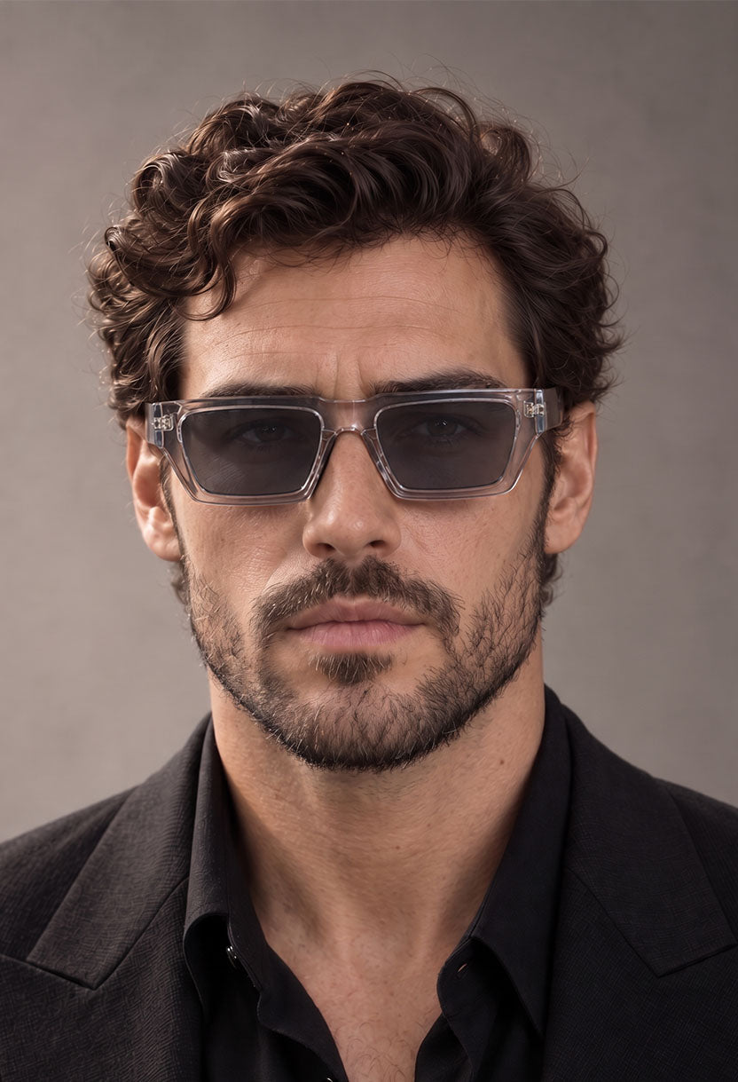 Man in a black shirt wearing NEW STATEMENT NEXUS sunglasses in transparent, front view #color_transparant